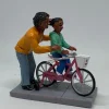 Personnage avec enfant Vélo