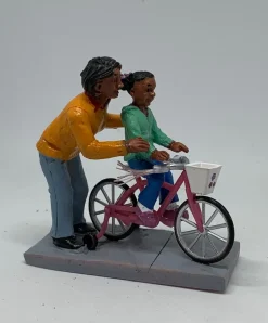 Personnage avec enfant Vélo